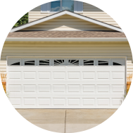 Beautiful white garage door on a light yellow house